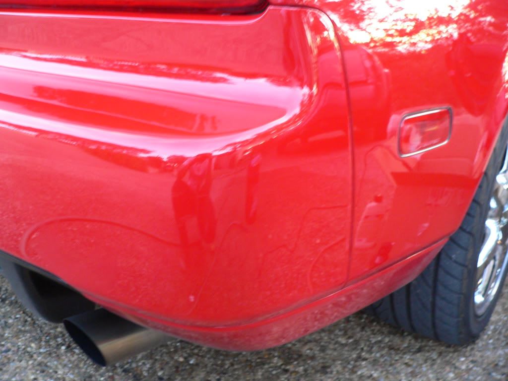 Paint on right rear bumper cover "dulled"