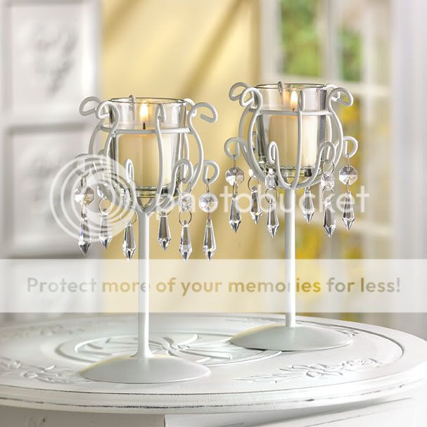  drops dangle from sleek ivory finished wrought iron candle stands 